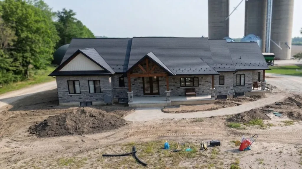 Front walkway installation in progress with excavation, grading, and base preparation at rural home